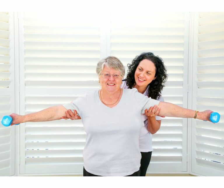 Senior-lady-holding-weights-768x644-2