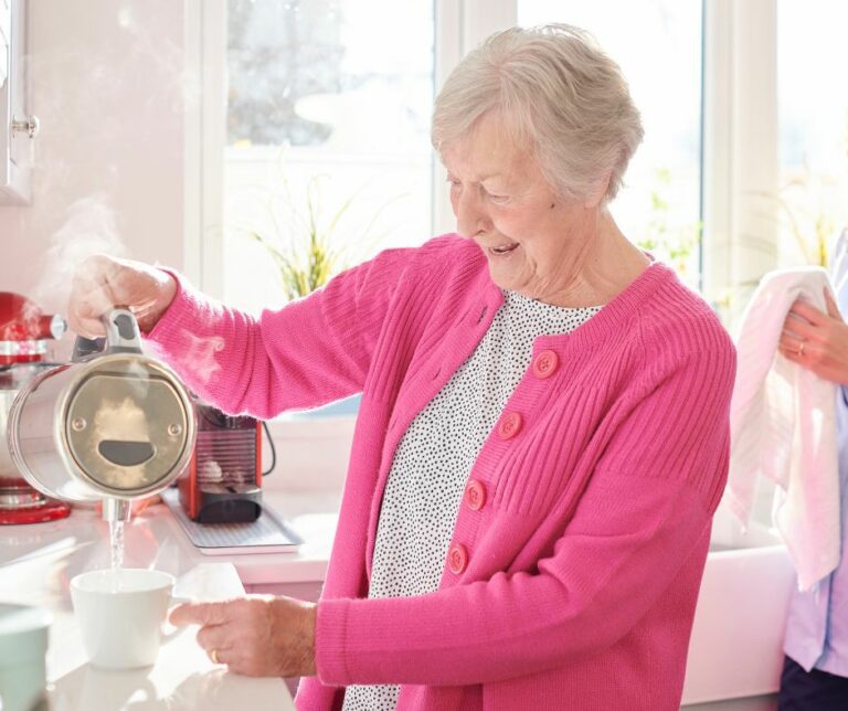 Senior-lady-pouring-kettle-768x644